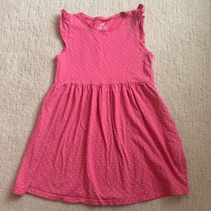 Girl’s pink dress.